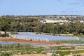 Maltese countryside in sunny winter day with vegetable greenhouses and arable land for growing crops