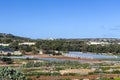 Maltese countryside in sunny winter day with vegetable greenhouses and arable land for growing crops