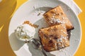 Maltese date filled pastry called Imqaret served with ice cream.