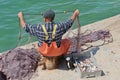 Maltese fisherman examining his nets