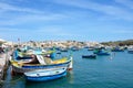 Maltese fishing boats moored in Marsaxlokk harbour. Royalty Free Stock Photo