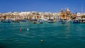 Maltese fishing village with boats and church Royalty Free Stock Photo