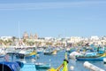 Maltese fishing village of Marsaxlokk with traditional painted boats Royalty Free Stock Photo