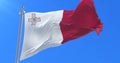 Flag of Malta waving at wind with blue sky in slow, loop