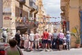 Maltese people fans watch football match on Valletta street