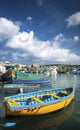 Maltese traditional painted luzzu boats in marsaxlokk fishing vi Royalty Free Stock Photo