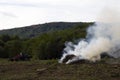 Malvern Hills, Worcestershire, UK. 09/12/18. Conservation on the Malvern Hills, workman helping clearing trees and shrubs and burn