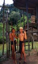 Malysia: Two young Iban head hunter boy`s with spears