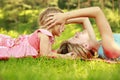 Mama and her little daughter lie on the grass Royalty Free Stock Photo