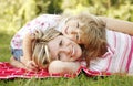 Mama and her little daughter lie on the grass Royalty Free Stock Photo