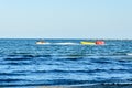 Man riding a jet ski over blue Black Sea water, banana boat. Royalty Free Stock Photo