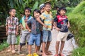 Mamasa, Indonesia - August 17, 2014: Group of unidentified funny children posing, smiling and looking at the camera in the country Royalty Free Stock Photo