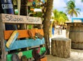 Mambo Beach, Curacao/Netherlands Antilles - March 15, 2019: flip flops coat rack