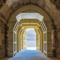 Mamluk era arched stones tunnel leading to Al-Muayyad Bimaristan ancient hospital, Cairo, Egypt