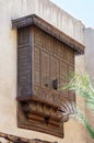 Mamluk era style oriel window covered by interleaved wooden grid - Mashrabiya - on stone wall, Cairo, Egypt