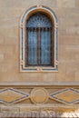 mamluk style arched Window with Wrought Iron Grilles in a brick wall