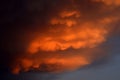 Mammatus clouds forming at sunset ahead of severe thunderstorm.