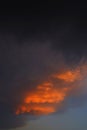 Mammatus clouds forming at sunset ahead of severe thunderstorm.