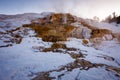 Mammoth Hot Springs with steamy terraces during winter snowy season in Yellowstone National Park, Wyoming