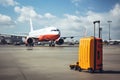 A mammoth jetliner sits confidently on the airport tarmac, ready to embark on its next journey, Luggage at the airport with a Royalty Free Stock Photo