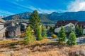 Mammoth Lakes, California is filled with homes and pine trees and snow covered mountains in the fall