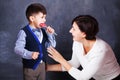 Mammy gives her boy a sweet lollipop Royalty Free Stock Photo