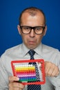 Man with abacus calculator Royalty Free Stock Photo
