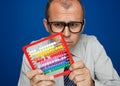 Man with abacus calculator Royalty Free Stock Photo