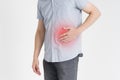 Man with abdominal pain, stomach ache on gray background Royalty Free Stock Photo