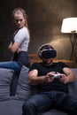 Man absorbed by game with angry girlfriend