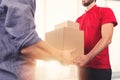 Man accepting a delivery of boxes from delivery service courier Royalty Free Stock Photo