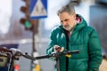 Man activating electric scooter from smartphone