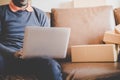 Man addicted to online shopping, full of delivered boxes