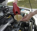 Man Adding Motor Oil to Car Royalty Free Stock Photo