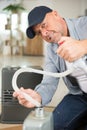 man adding oil to heater Royalty Free Stock Photo