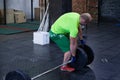 Man is adding weight to the barbell