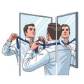 A man is adjusting a blue tie in front of a two-segment mirror. He is wearing a white Royalty Free Stock Photo