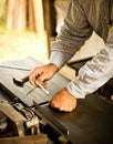 Man adjusting planer knives wood polishing machine