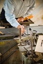 Man adjusting planer knives wood polishing machine