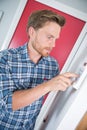 Man adjusting temperature electric boiler Royalty Free Stock Photo