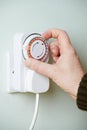 Man Adjusting Timer On Electrical Socket Royalty Free Stock Photo