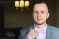 Man adjusts his bow tie Royalty Free Stock Photo