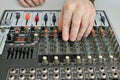 The man adjusts the mixer, turns the potentiometers Royalty Free Stock Photo