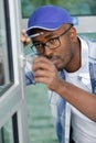 man adjusts window key Royalty Free Stock Photo