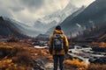 Man admiring beautiful foggy landscape in autumn mountains. Adventurous young man with backpack. Hiking and trekking on a nature Royalty Free Stock Photo