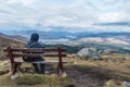 Man admiring landscape view on a bench Royalty Free Stock Photo