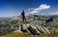 Man admiring the rocky mountain landscape in Retezat National Park, Carpathian Mountains, Romania