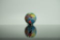 Man adult carrying bag doll walking towards blurred earth sphere. Royalty Free Stock Photo