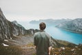 Man adventurer admiring fjord and mountains view Royalty Free Stock Photo