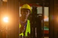 Man african american wear safety holding walkie talkie driver forklift warehouse in factory. Male worker industrial operate. Royalty Free Stock Photo